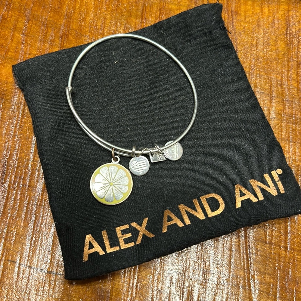 Alex and Ani silver bangle with lemon charm